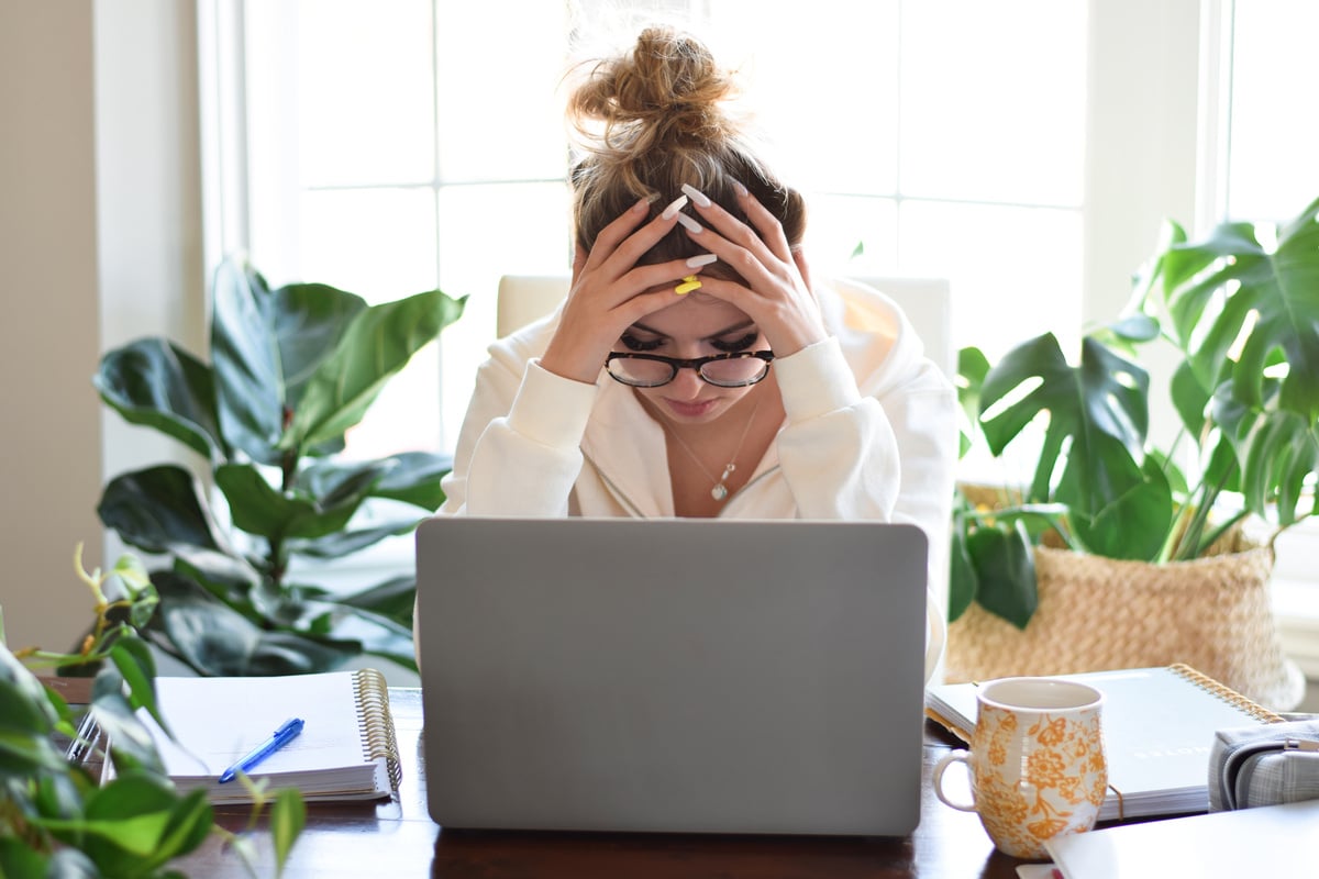 Young teenage girl student feeling tired stressed and frustrated studying at home